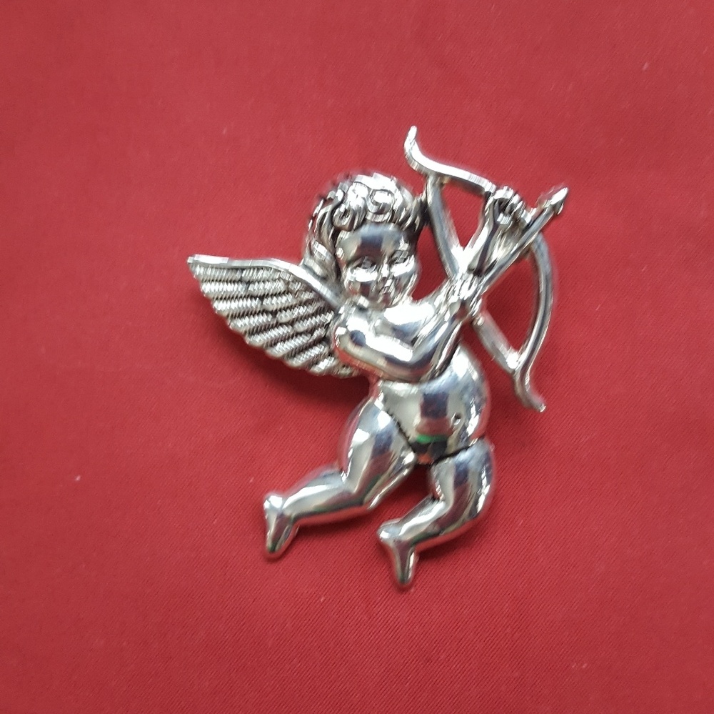 Sterling silver angel pin and pendant.